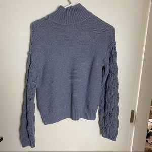 Grey turtleneck sweater with crochet sleeves